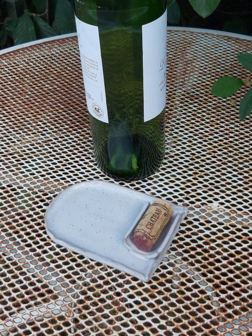 Repose bouteille de vin blanc moucheté